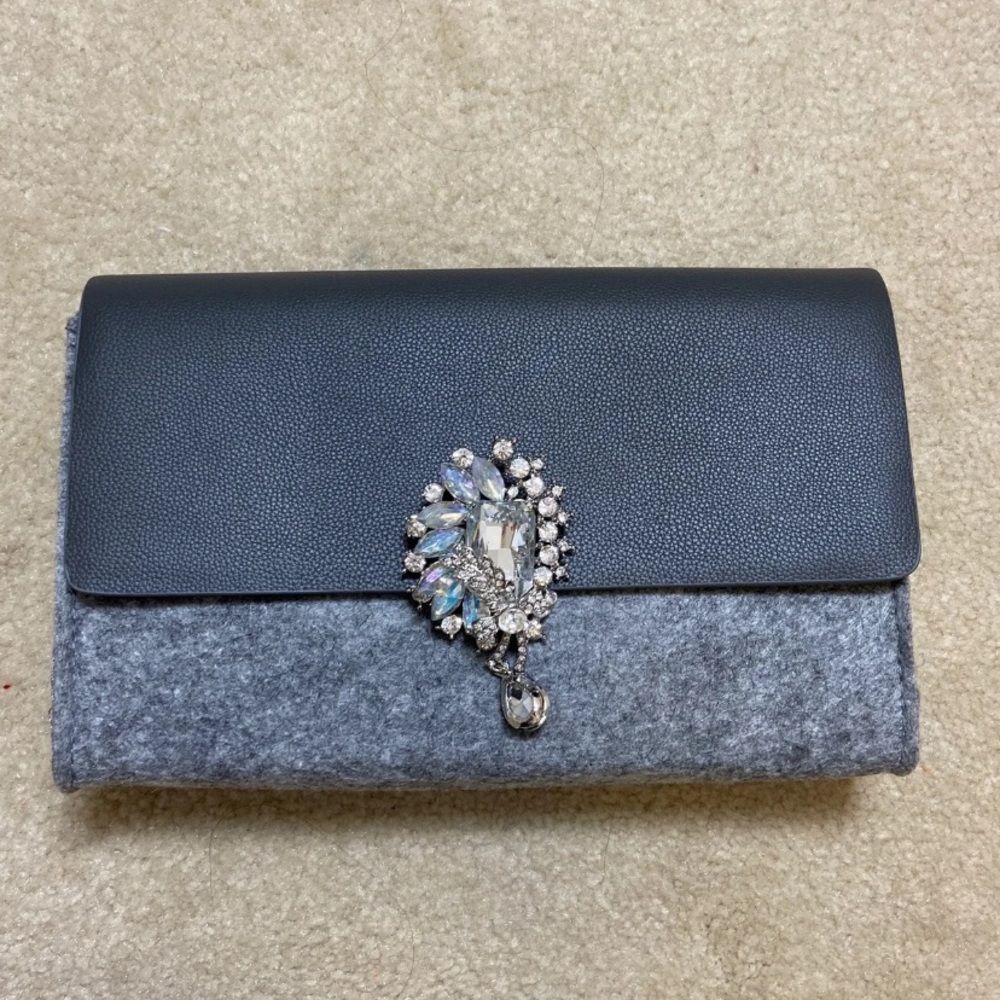 La Prarie clutch with brooch pin